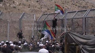 Hundreds of Druze community members gather at Golan Heights border amid clashes in Syria