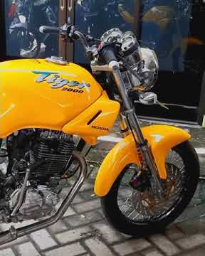 Story'wa motor Honda Tiger ll warna kuning