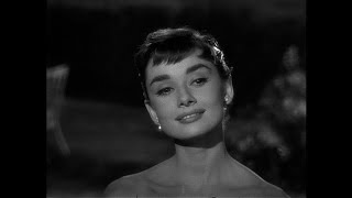 The chauffer's daughter arrives at the party -- Audrey Hepburn as Sabrina