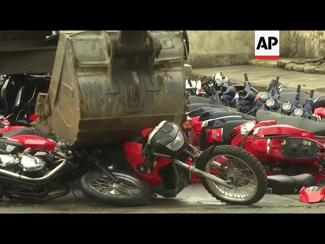 Philippine president witnesses destruction of smuggled luxury vehicles