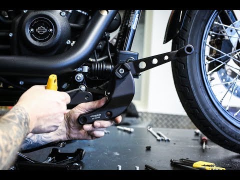 Video: Wie installiert man die vorderen Fußrasten an der Sportster?