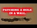 PATCHING A HOLE IN THE WALL.