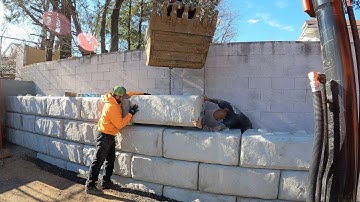 Retaining wall setting the the first course