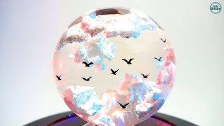 Birds in the clouds in the resin art sphere, [clouds in the sphere], epoxy resin. DIY