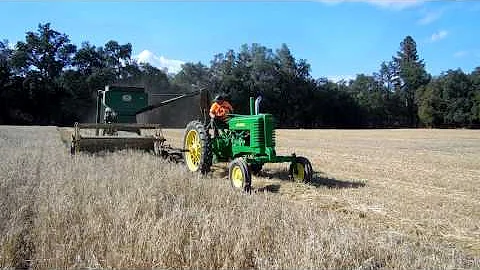 John Deere 42 combine harvesting oats
