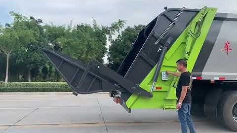 Compression garbage truck operation video