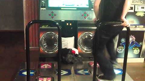Travis playing DDR - Dance Dance Revolution