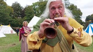 Troubadour musicians playing ancient songs with original medieval  instruments