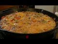 A Delicious Frittata using Bacon, Fried Potatoes, Tomatoes, Onions, Peppers, Eggs and Cheese