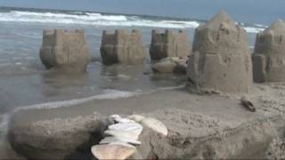 Sand Castle Destruction by Wave