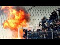 Riot police clash with Ajax fans at Champions League match
