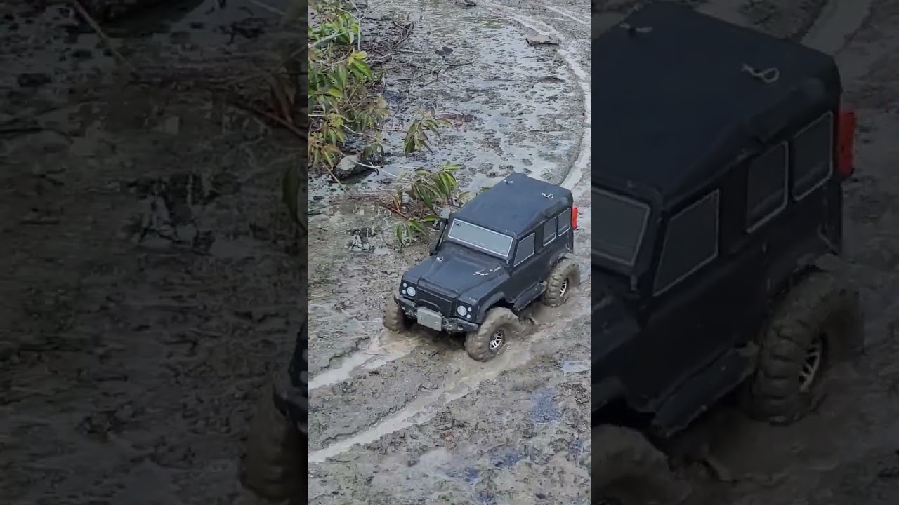 Blacked Out Landrover Defender getting through some MUD!! 