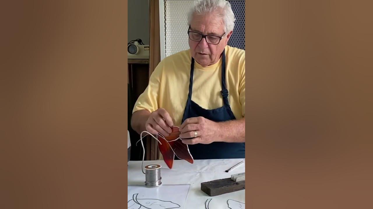 Copper foil curved stained glass pieces with a foiling machine