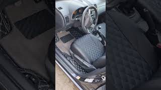 Чехлы экокожа Toyota Corolla E150 - Черные с синей ниткой / Видео