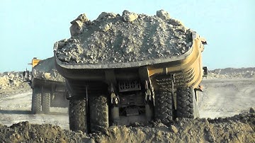 Heavy Dumpers in Action: Komatsu HD785 & Caterpillar 777 Dumping at the Disposal Area