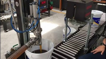 Semi automatic motor oil weighing filling lid pressing machine