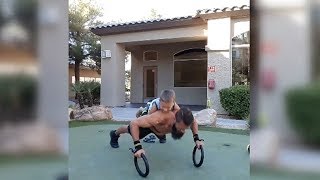 Man Doing Push-ups While His Kid Is On His Back