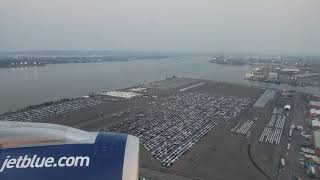 Jet Blue - A321 evening landing at Newark (EWR) runway 29 with NYC in the background. 7/7/2021