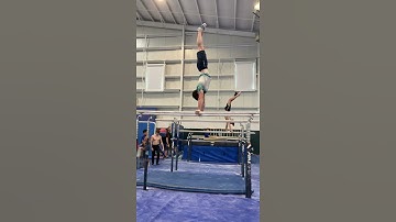 Double Front Flip Stick on Parallel Bars