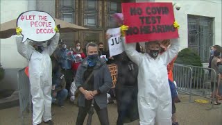 Demonstrators protest ahead of final day of Judge Amy Coney Barrett confirmation hearing