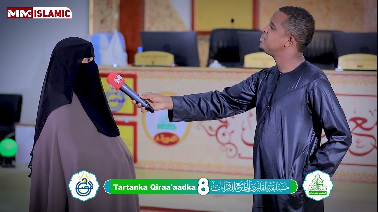 Xaaska sh xasan Al-Waajidi  iyo gabadh uu dhalay oo ka qayb galay Tartanka Al-Misbaax.