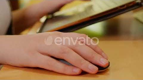 Freelancer Woman Using Mouse for Laptop | Stock Footage - Envato elements