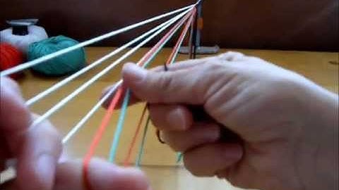 Color linking in a flat 7-loop braid part 1