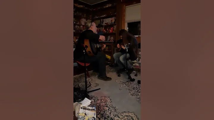 Rayne and Jim playing guitar