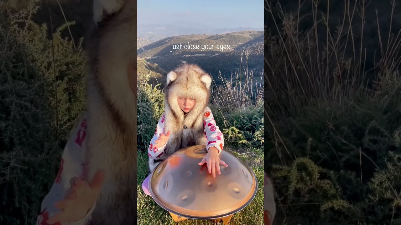 Playing hand pan with closed eyes