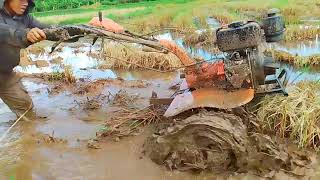 Plowing the land with a mini tractors