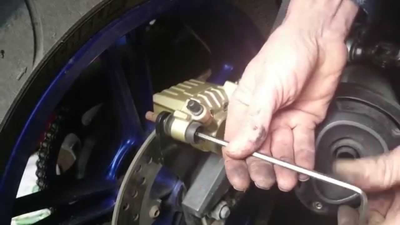 R125 Rear Brake How to replace rear pads on a yzf r125 - YouTube