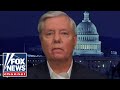 Lindsey Graham reacts to being swarmed by Trump supporters in airport