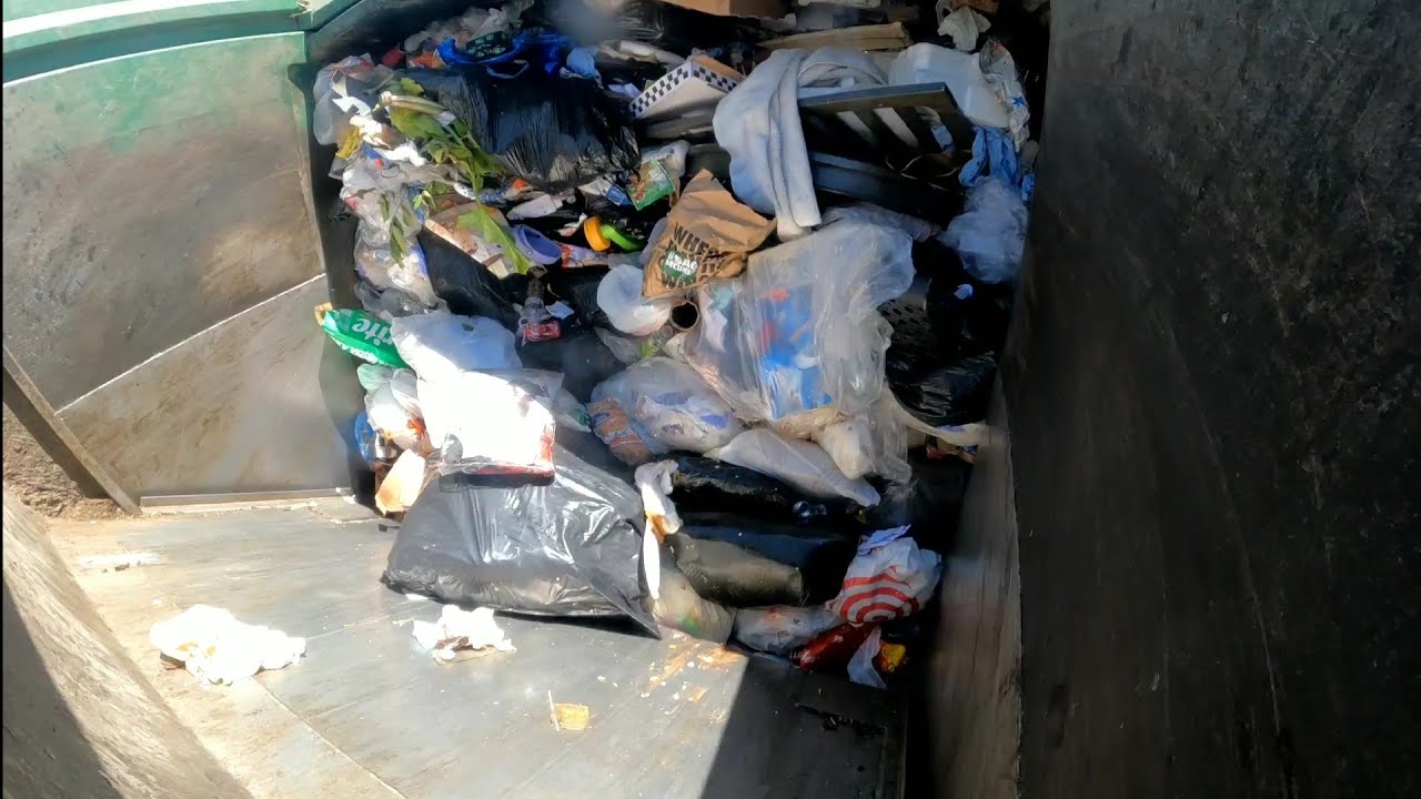 Waste Management front load garbage truck packing wet garbage part 2
