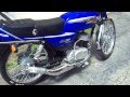 Suzuki Ax100 con escape DM