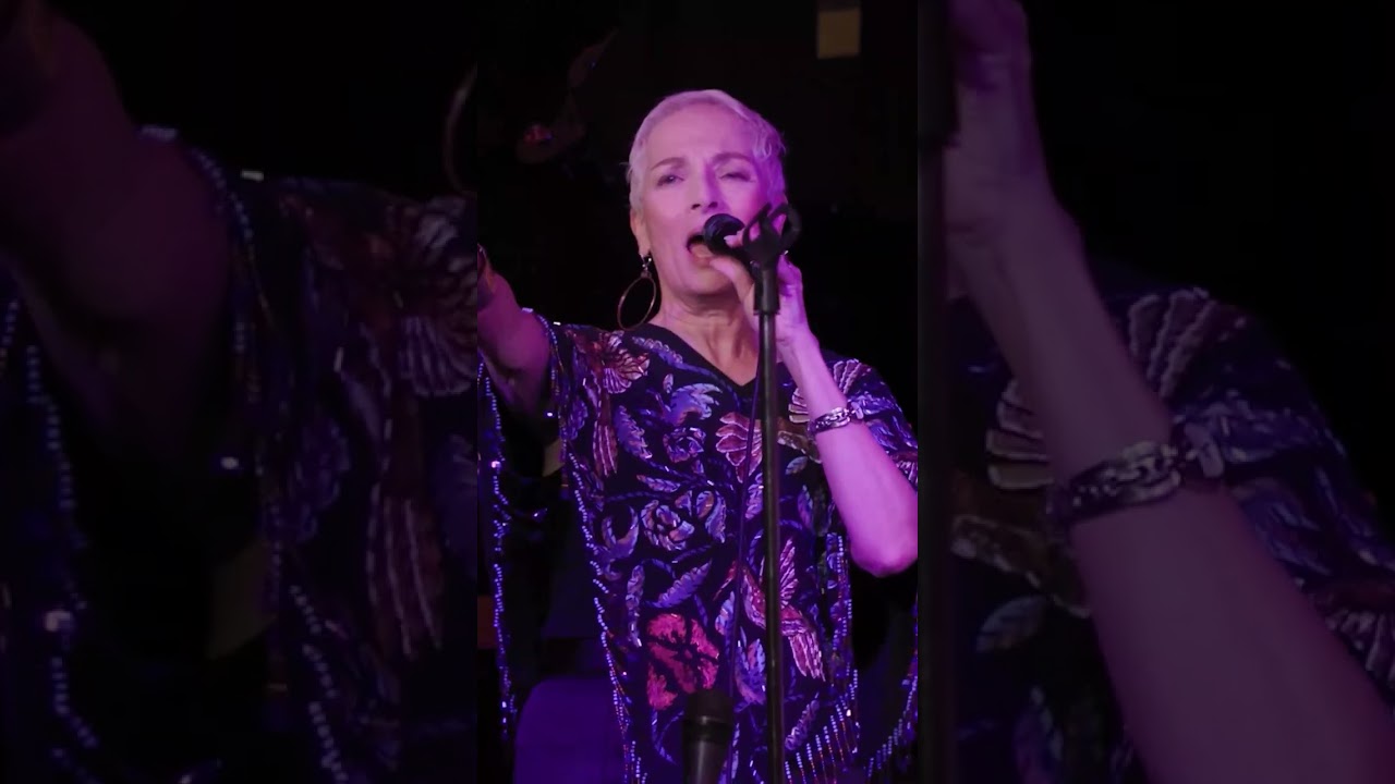 Singing live on stage, feeling every note,