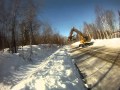 Komatsu pc200 clearing snow from ditches