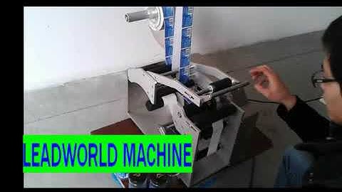 Video of semi automatic round bottle labeling machine from Ernest