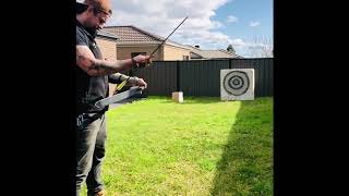 Robin Hood bullseye with recurve bow