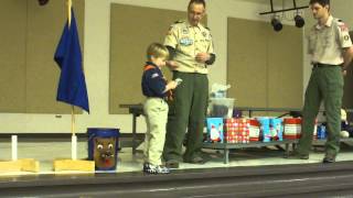 Georgie gets his first Cub Scout belt loops and pins