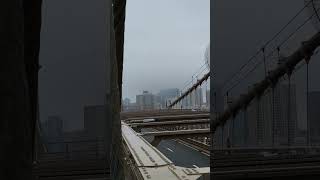 The statue of Liberty in New York City from the Brooklyn Bridge