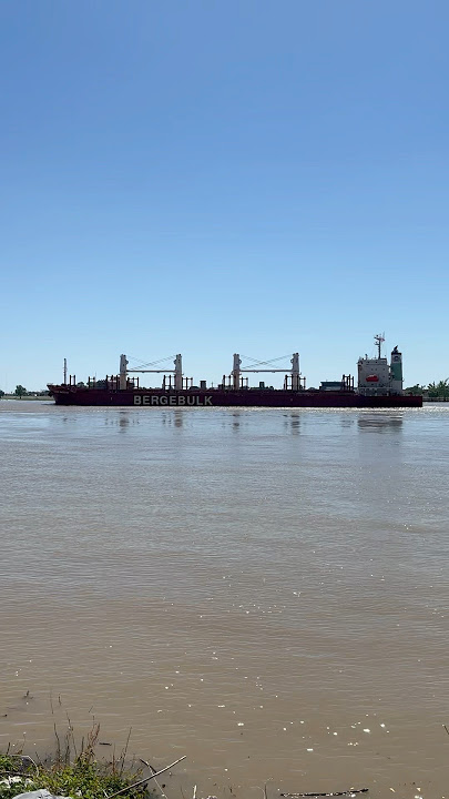 Cargo ship heading down river