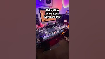 Wide ergonomic keyboard tray frees desk space