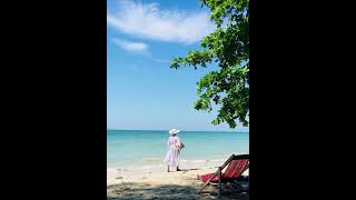 Pretty woman walking on the beach