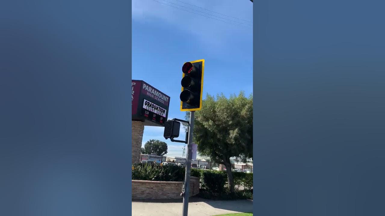 Downey Ave at Rosecrans Ave intersection traffic signal with yellow