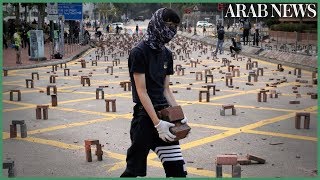 Pro-democracy protesters challenging china's rule of hong kong choke
the city for a fourth straight working day, firing catapults at
police, barricading road...