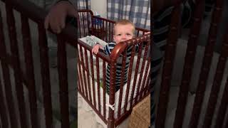 Bouncing Baby In His Bed Excited To See Daddy