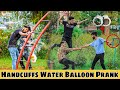 Handcuffing people then throwing water balloons on them  prank in pakistan