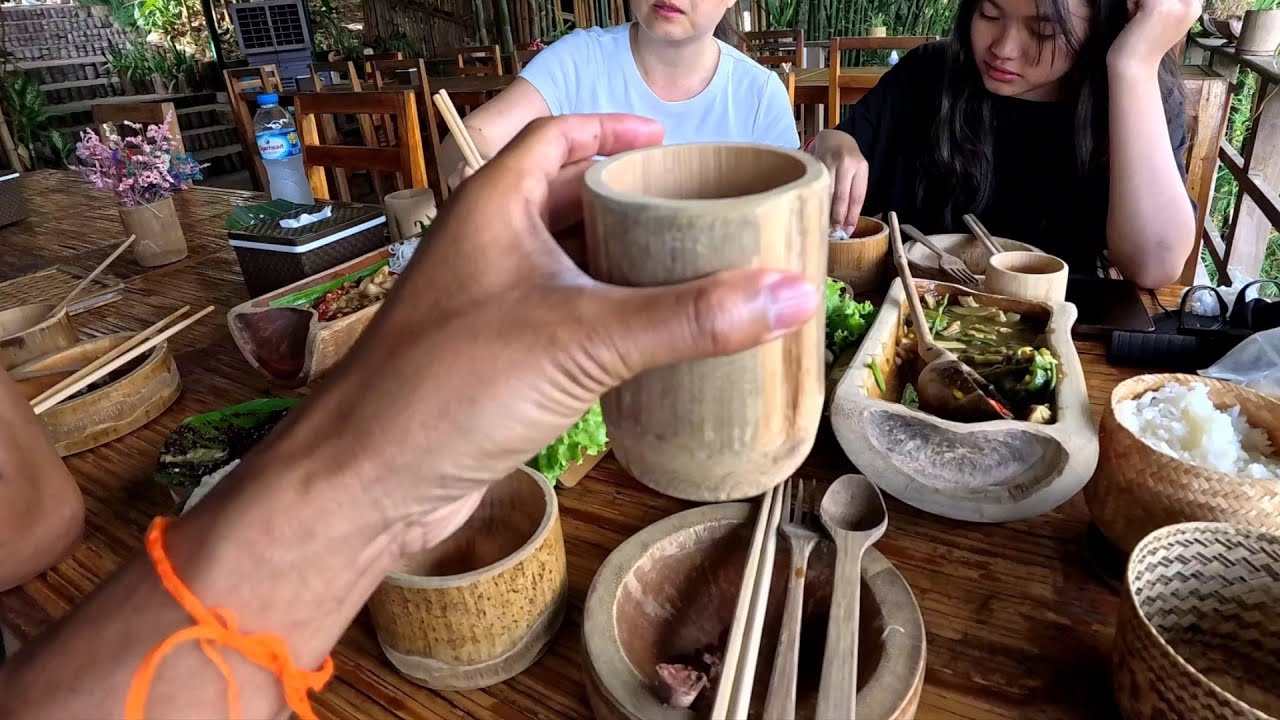 Restaurant Serving food on wood, in Laos / Eating at Luang Prabang Bio Bamboo with family