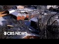 Millions of Americans face frigid temperatures as power outages persist for some