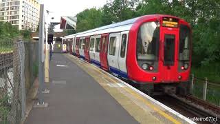 London Underground S7 Stock no. 21546 departs at Kensington Olympia